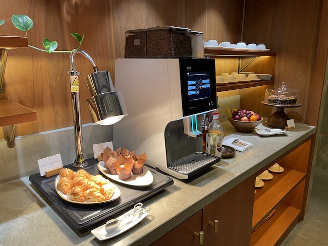 a coffee machine and food on a counter