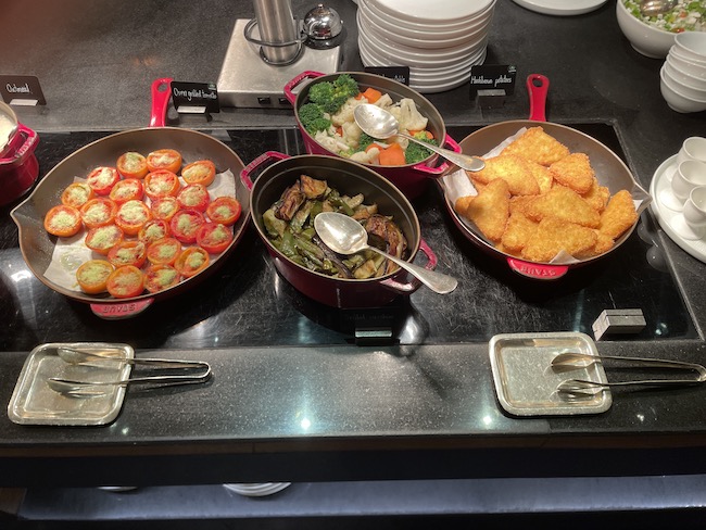 a group of pans with food in them