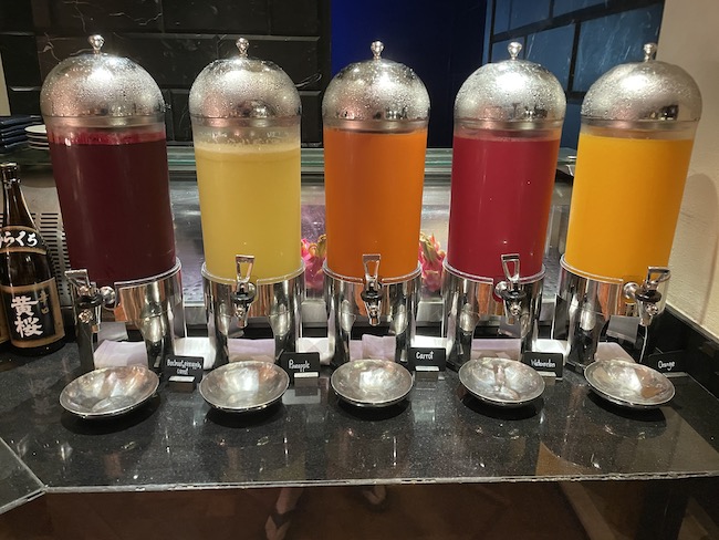 a row of different colored drinks