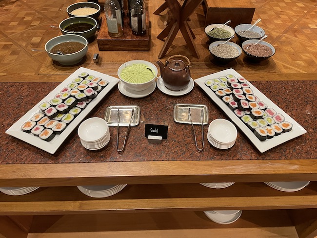 a table with different types of sushi on it
