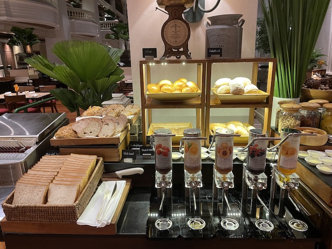 a buffet with bread and drinks
