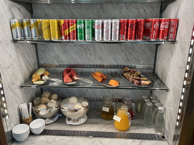a shelf with food and drinks on it