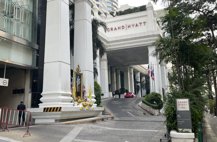 a white building with columns and a sign