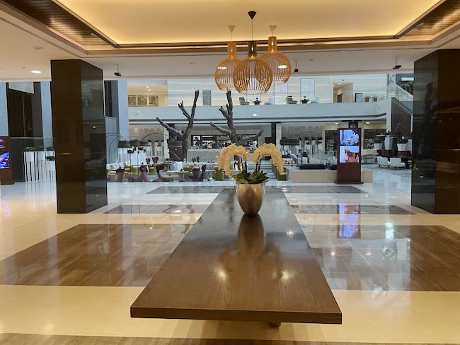 a large wooden table in a lobby