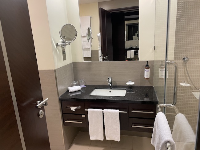 a bathroom with a mirror and sink