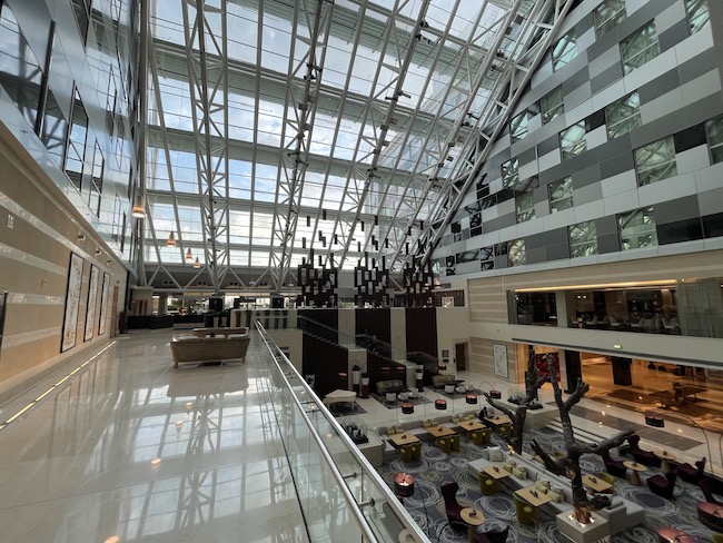 a large building with glass walls and a large ceiling