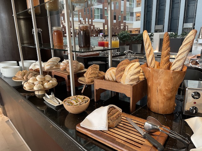 a counter with bread and food on it