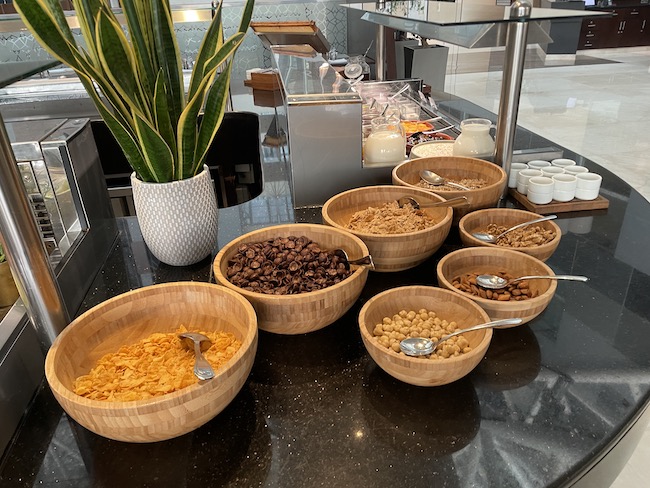 a group of bowls of cereal and cereals