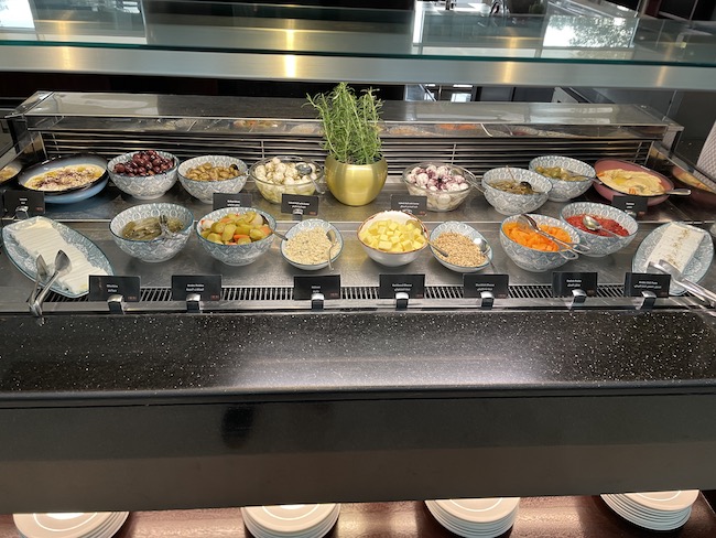 a buffet with different bowls of food