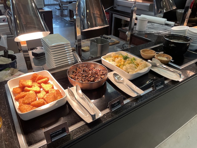 a buffet table with food in bowls