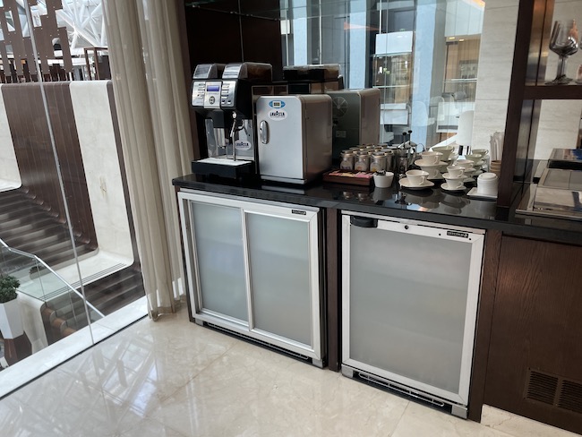 a coffee machine and two refrigerators