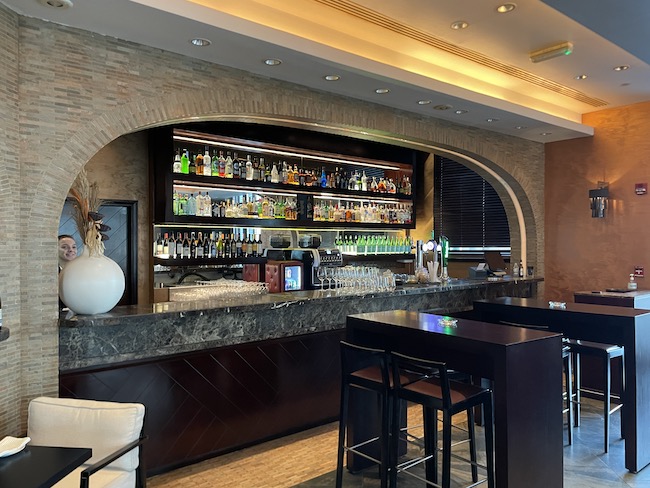 a bar with a counter and bar stools