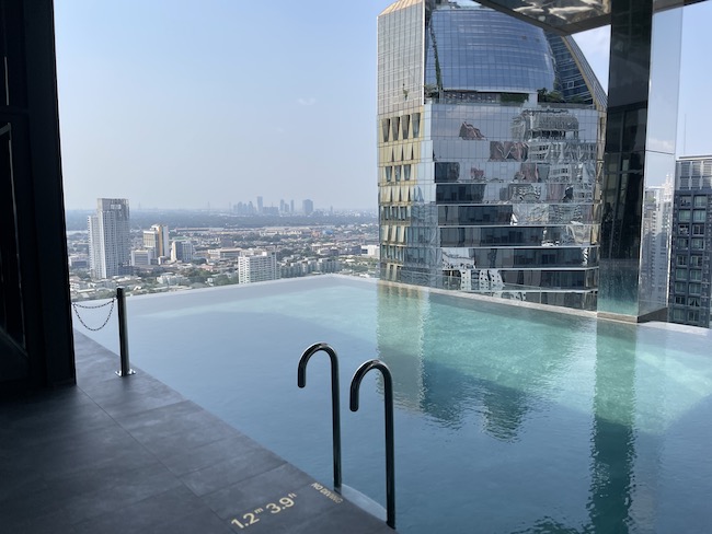 a pool with a city view