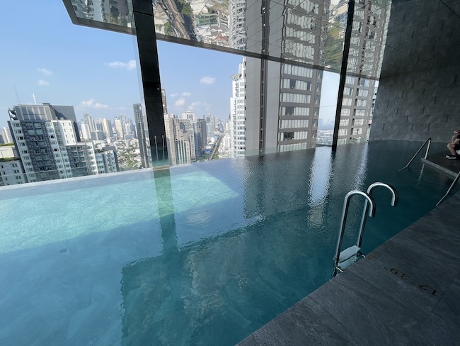 a pool with a view of a city