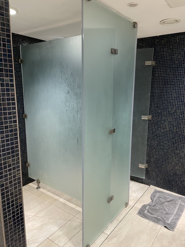 a glass shower stall in a bathroom