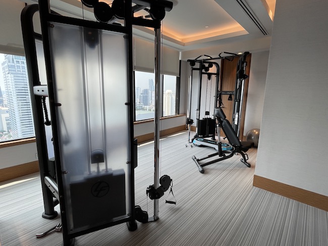 a gym with exercise equipment in a room