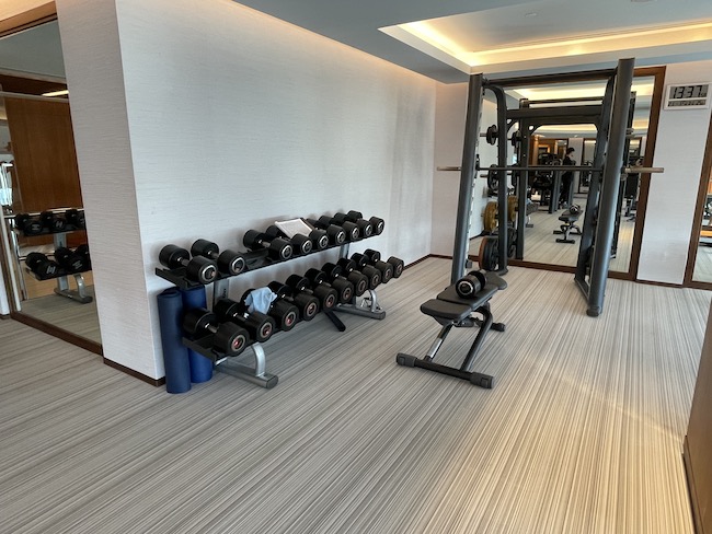 a room with weights and a mirror