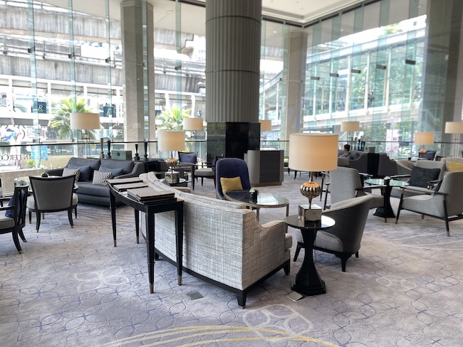 a lobby with chairs and tables