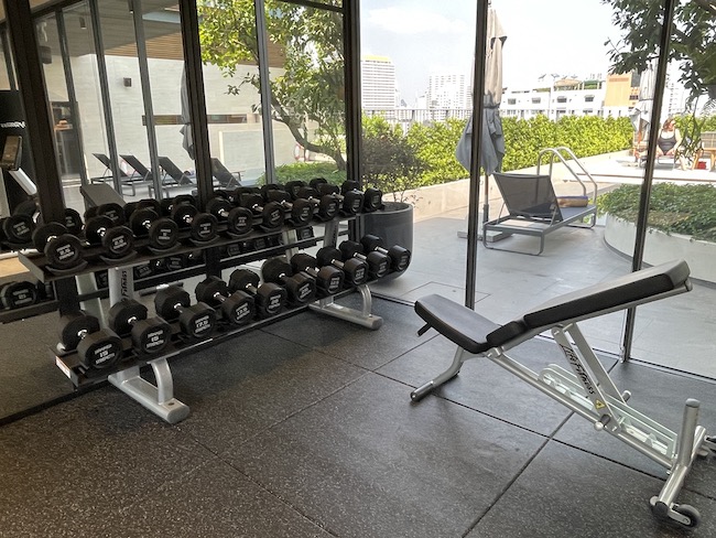 a gym with weights and bench