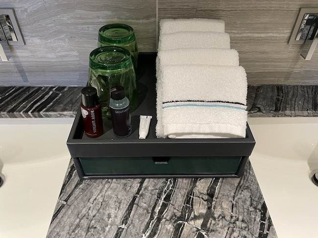 a tray with towels and bottles on it