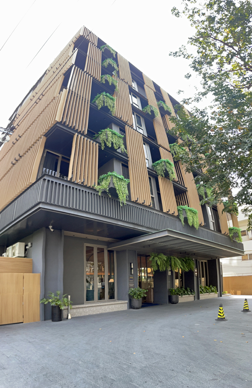 a building with plants on the side