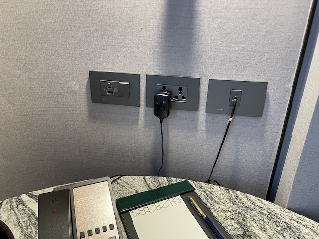 a wall outlet with a charger plugged into it