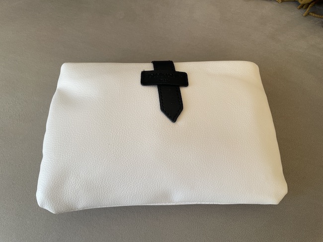 a white bag with a black cross on it