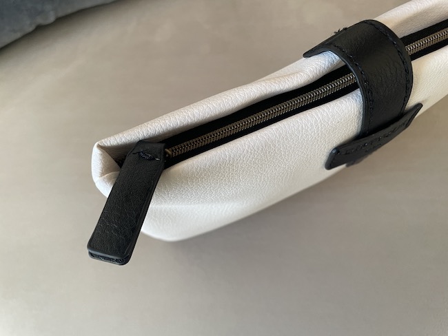 a white and black pouch