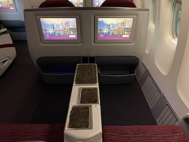 a seat with two monitors on the side