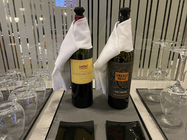 two bottles of wine wrapped in napkins
