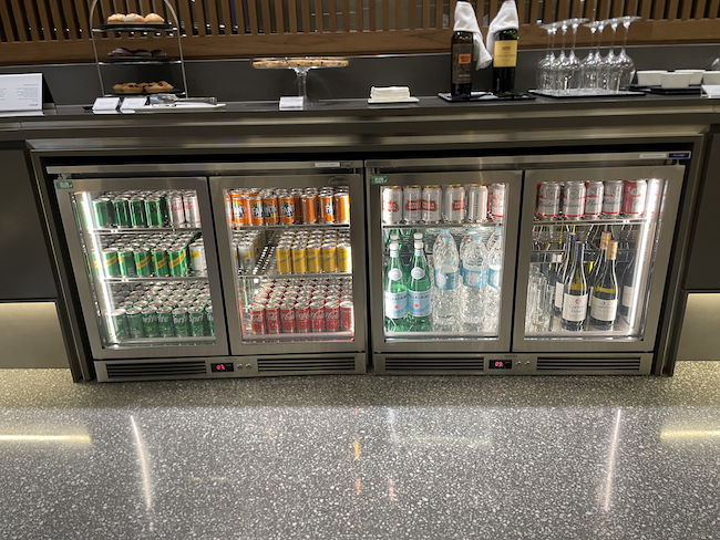 a refrigerator with drinks and beverages