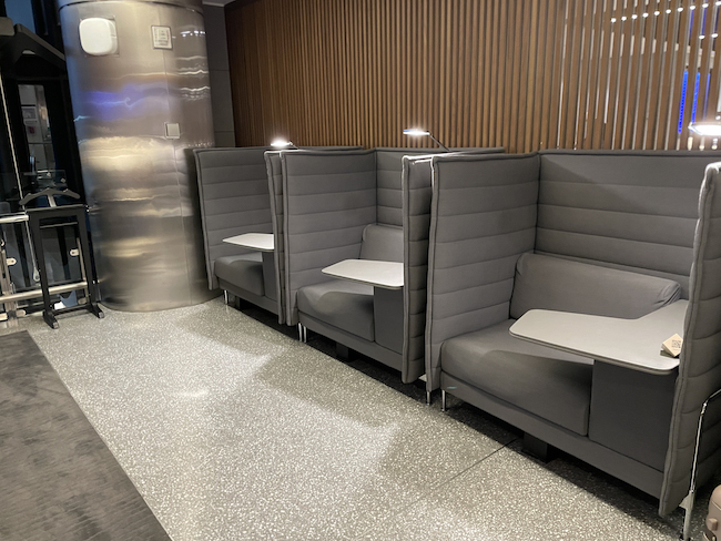 a row of gray chairs in a room