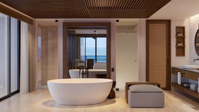 a bathroom with a tub and a chair
