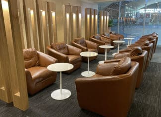 a group of brown chairs and tables in a room