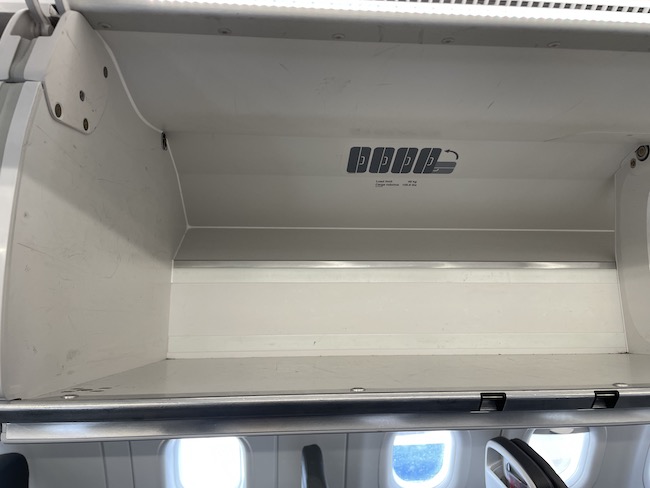 an empty shelf on an airplane