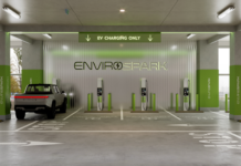 a car charging station with green and white text