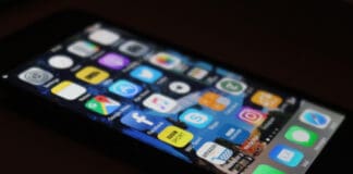 a cell phone with apps on the screen