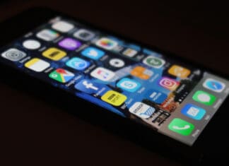 a cell phone with apps on the screen