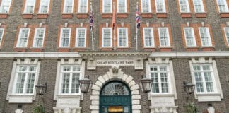 a building with flags on the front
