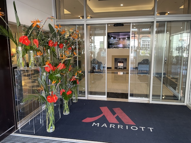 flowers in vases outside of a building