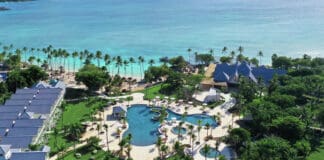 a resort with a pool and palm trees