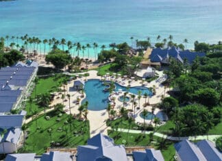 a resort with a pool and palm trees