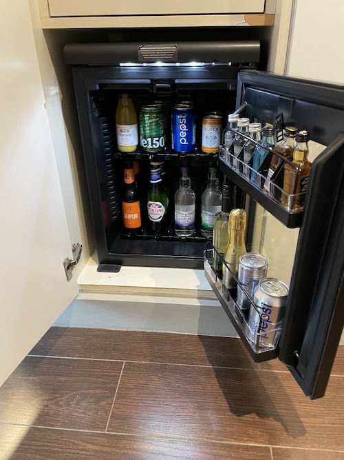 a mini fridge with drinks inside