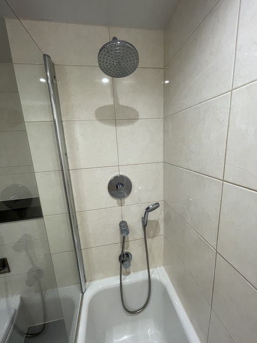 a shower head and tub in a bathroom