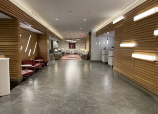 a hallway with chairs and tables
