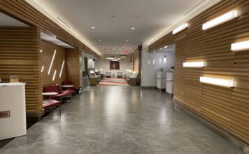 a hallway with chairs and tables