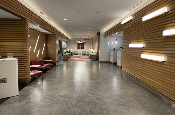 a hallway with chairs and tables