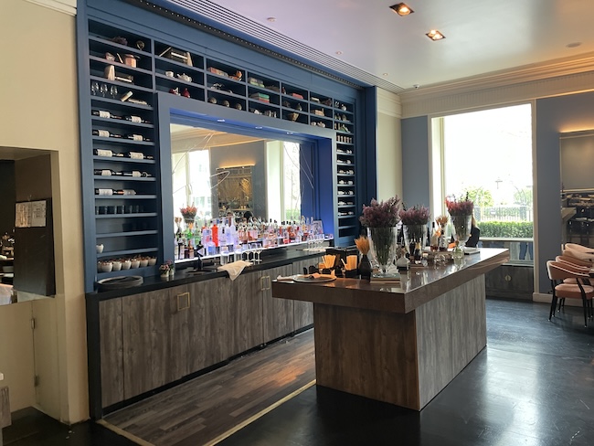 a bar with a mirror and shelves