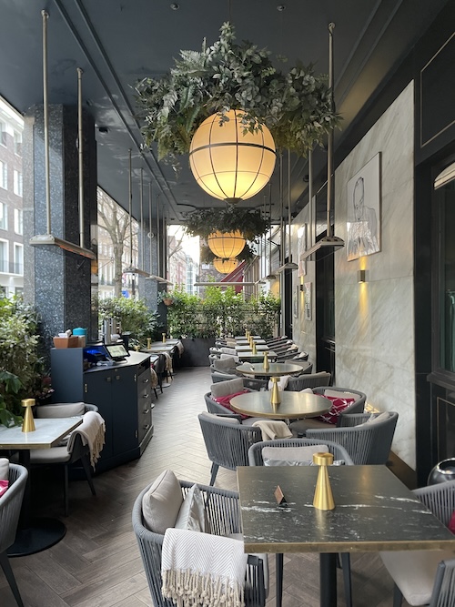 a restaurant with tables and chairs