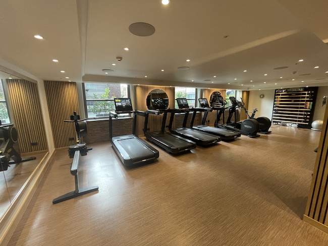 a room with treadmills and exercise equipment